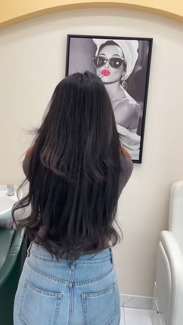 Inside MK Beauty Salon — cream arches, gold trim and emerald styling chairs